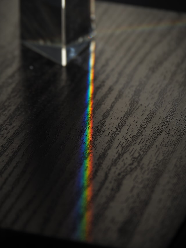 light through prism into rainbow